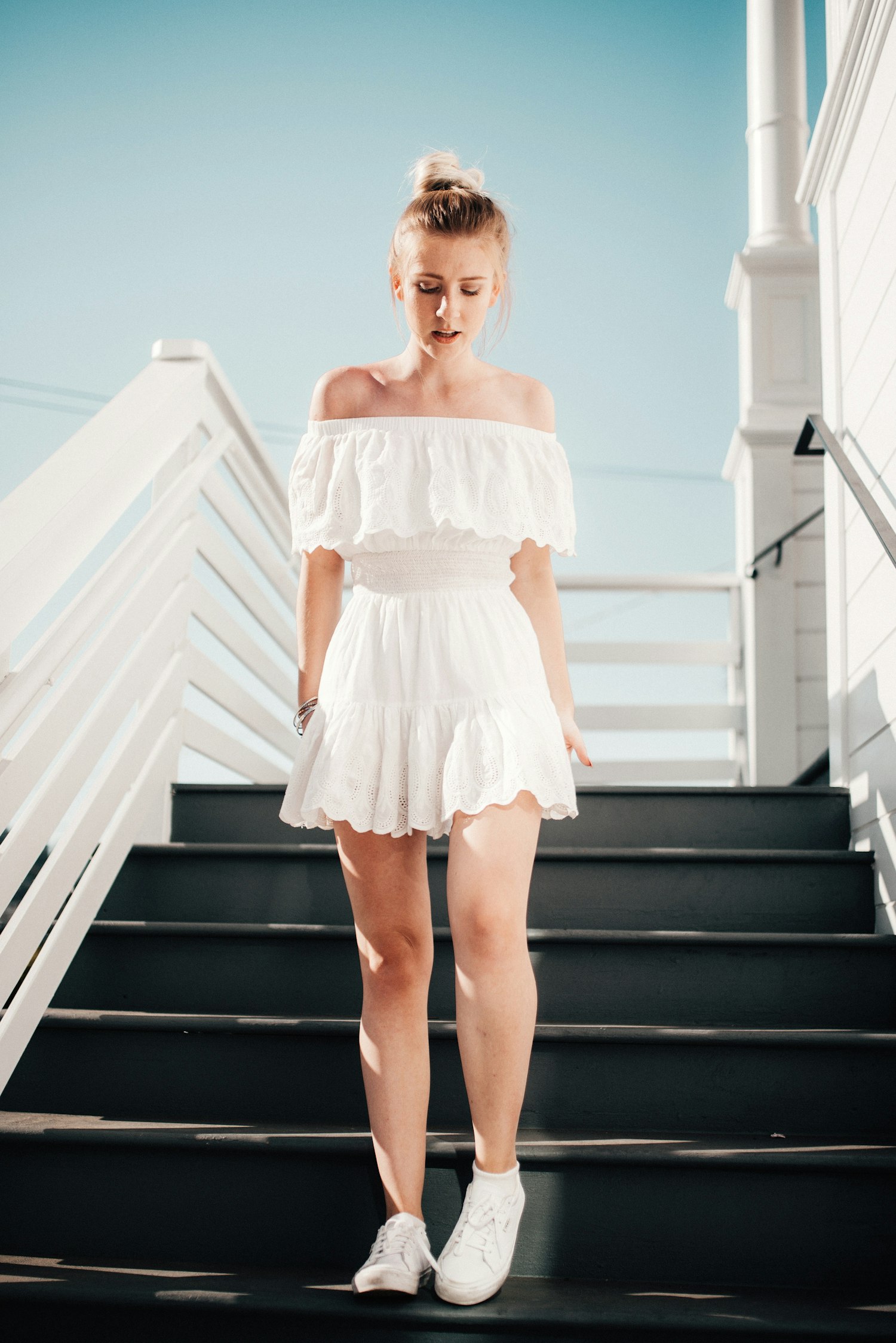 Runway walk in a white tiered dress